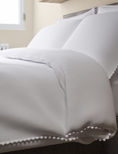2998a432e828237bc21625c05e54a6f9cab99c5da21f7c6b477fd798caf74f53-2.jpg An Image of M&S Cotton Rich Pom-Pom Trim Bedding Set