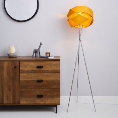 33a422e158b7e80603fb7134e9aea35f192faf2d4ef025c7af2bd6c9ca8f3811.jpg An Image of Elements Harley Tripod Ochre Floor Lamp Yellow