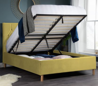 49b73cf7b55a85f8efcfd08ea34665a4583a0fb7dc10f7b9fd426258d7aef128.jpg An Image of Loxley Mustard Velvet Fabric Ottoman Storage Bed Frame - 4ft Small Double