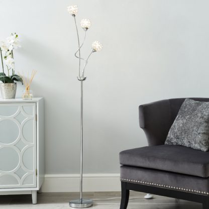 6ff540bbe0f90ed37d3aef7f129eef6b249c849b4b647e999d66a641a7c9055e.jpg An Image of Portia 3 Light Floor Lamp Chrome