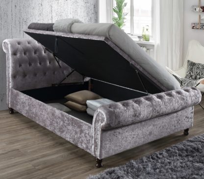 b3ae852511c972bbce7916d089fa735b9349d18d4f7759bb2b9ccd8ff7cccd59.jpg An Image of Castello Steel Fabric Ottoman Scroll Sleigh Bed - 5ft King Size