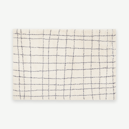 fc5fd702b291b639269f21e23b64f8e014abb35ff8ba3cbe7917edb85b0473f3-1.png An Image of Gunter Pile Rug, Small 120 x 170cm, Ecru & Midnight Blue