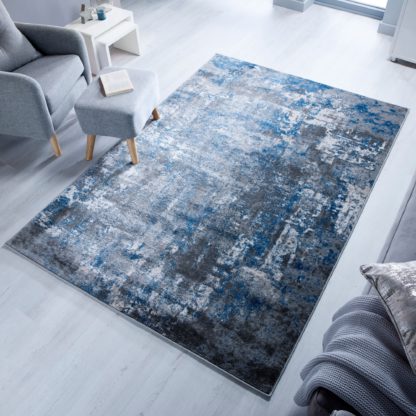 5a928c419fed84ad42b8a4148ab55a32773d34b9b72d3de9bdd0dde55238e2b9-1.jpg An Image of Wonderlust Rug Grey