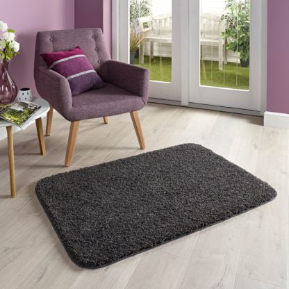 e3c20f5b1a61f5cafa192a9feb651136385dbffb8d02be9b51b8d8a60894ca24.jpg An Image of Marvel Shaggy Washable Rug Cream