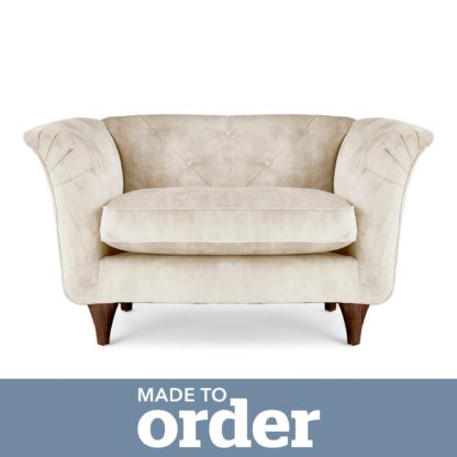1bb7bbf0bdcd5da7d23741d1c30b879e25d935f33e9680912f66f7ec653944e7.jpg An Image of Jaipur Snuggle Chair Slub Velvet Green
