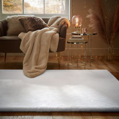 26d25111a31f349efff3f00cc54ea953ffa94e0b0da2af4b4854517d6c07f623.jpg An Image of Plush Faux Fur Rug Faux Fur Plush Chateau Grey