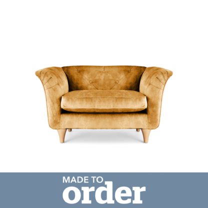 27732cba0a6d1b506f11bea1aeffd09870619af6d274ddeaa920ad54f4f9821c.jpg An Image of Jaipur Snuggle Chair Slub Velvet Green