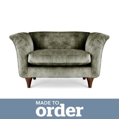 46f18ab9c17c4595f3ffa911a54ce03c18fe3da2710d0ed7c277f7c1ccf9105c.jpg An Image of Jaipur Snuggle Chair Slub Velvet Green