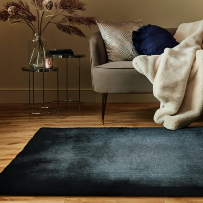 52fd023dcd84ff788f5d70fd0a1d3f72311677d656f31bbec1e679aed78470a7.jpg An Image of Plush Faux Fur Rug Faux Fur Plush Chateau Grey