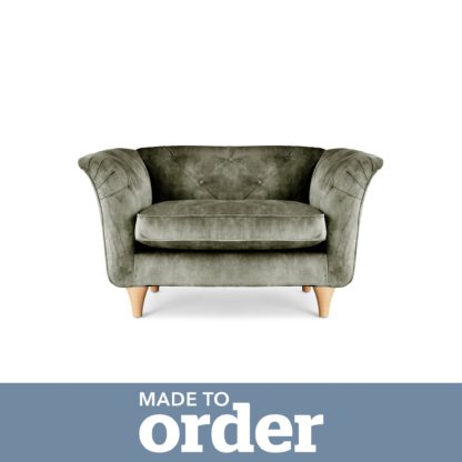 54d56e2d90ea86f393b24acaffa6f29487fbe4d748874b23959ee4eba5b240a7.jpg An Image of Jaipur Snuggle Chair Slub Velvet Green