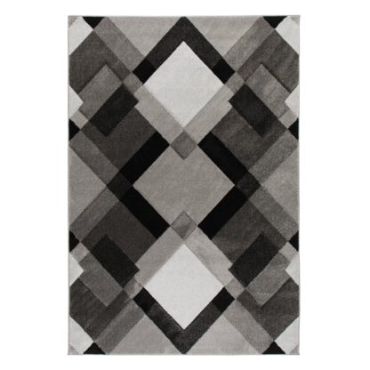 87c4517f5d7585400aa48a846663754df8e71ece3ed27d12b9a93a53b0e6b48c.jpg An Image of Hand Carved Nimbus Rug Grey