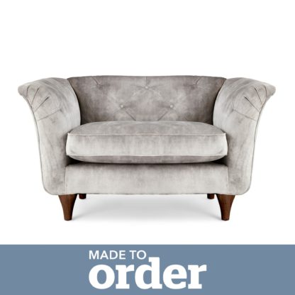 a56fc1b35e006439ba45aae091f83944a9a8539860d43d168c39d855a93d78f4.jpg An Image of Jaipur Snuggle Chair Slub Velvet Green