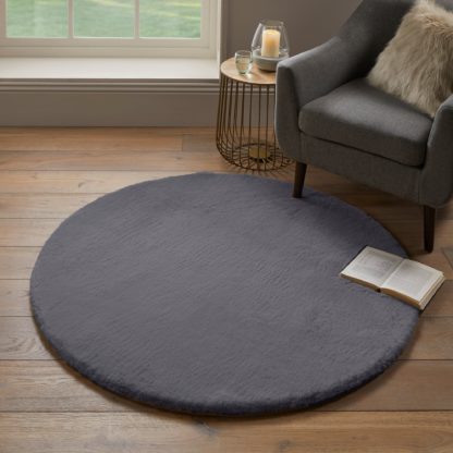 e580b8470295bd8fb9809da99d30602f4c6300c39479b54cf27de0c3d692bc83-1.jpg An Image of Faux Fur Supersoft Lush Circle Rug Grey