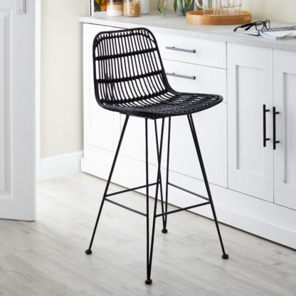 a3cf02fb39d7ea753dd9b312da6cfd9bb75c19b53c6894a0cefc2ae733f56a39.jpg An Image of Pax Rattan Barstool Black