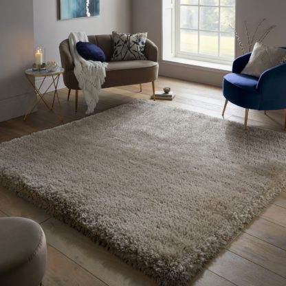 50a4f1b2eee9b3a43cea31cef0383bd440ef627da29988a0d22b4241b7d9797a.jpg An Image of Jewel Shaggy Square Rug Jewel Emerald (Green)