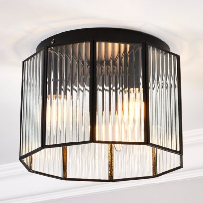 83e0060a22a9db6ffa154f5d285f05600642d9b45303c91dc478908582880575.jpg An Image of Voss 3 Light Flush Ceiling Fitting Black