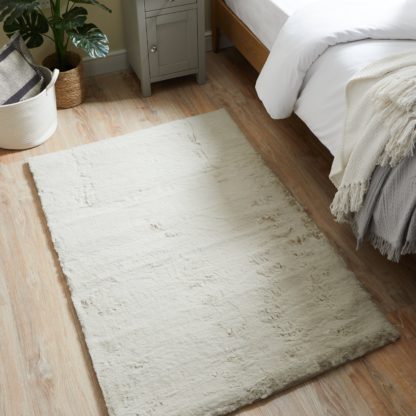 892efd8b865b4ef5f5f953d76f96a872cf4f9677fc6d864ab71642f73739bd4c.jpg An Image of Faux Rabbit Fur Rug Natural