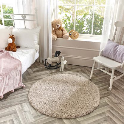 3443a572a132ff4052ee8d70a2232569824af8dc98f97e64917f5860986dff4e.jpg An Image of Marvel Shaggy Washable Circle Rug Marvel Shaggy Navy