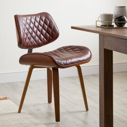 9deeffd191d00b4850ea9169b5f4a21e11c06186a46cca6e3f4c16f8ecea754c.jpg An Image of Remy Dining Chair Black