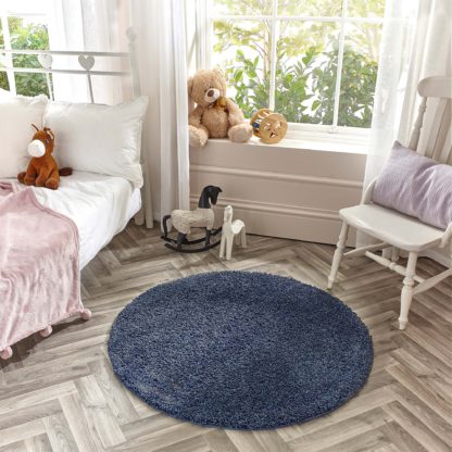 d5cc53ada7b28e19e07aacd43cb3f96ae831aff39f385507e280e9675122b83f.jpg An Image of Marvel Shaggy Washable Circle Rug Marvel Shaggy Navy