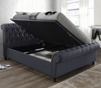 d72e4232023acc728a1ba7daf041cdbbbc15f4069d68fab7a6572f8ee86627b1.jpg An Image of Castello Charcoal Fabric Ottoman Scroll Sleigh Bed - 4ft6 Double