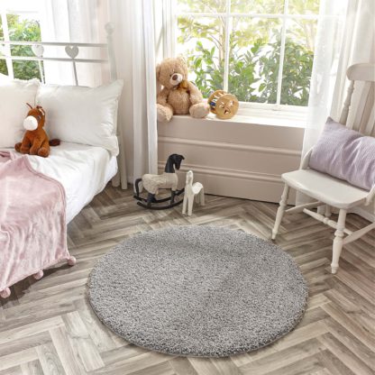 e8ca73aa9892b93ca618cc0208a9bef2d04c8bb3dcf3dcf0b6b2c727d9398d09.jpg An Image of Marvel Shaggy Washable Circle Rug Marvel Shaggy Navy