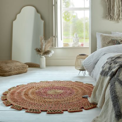 An Image of Elora Jute Circle Rug Elora Jute Natural and Pink