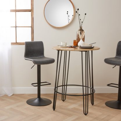 An Image of Bella Hairpin Leg Round Bar Table Brown