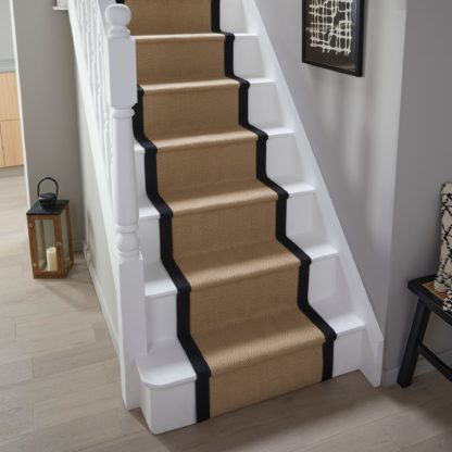 3b9a28238303ae477a1e568cd0f82ed0f6d8787574db8483f19f42f7521af29f.jpg An Image of Herringbone Jute Border Stair Runner Herringbone Border Natural