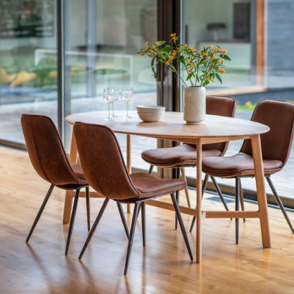 An Image of Hinton Oval Oak Dining Table Light Wood