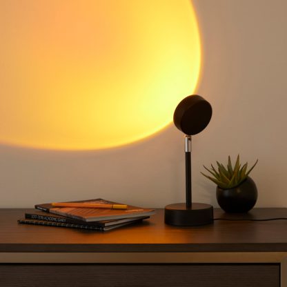 49ebe82d56cf043096d98f4b785de9ee0f03c2ea2fa59bf24a22ddf98a74b6ce.jpg An Image of Sunset Table Lamp Black