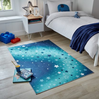 6e810fac7b1d9ea56e81ff731b0c24b26fb6629f77882e4ae342bf85cc09c8e5.jpg An Image of Fold Galaxy Washable Rug Blue
