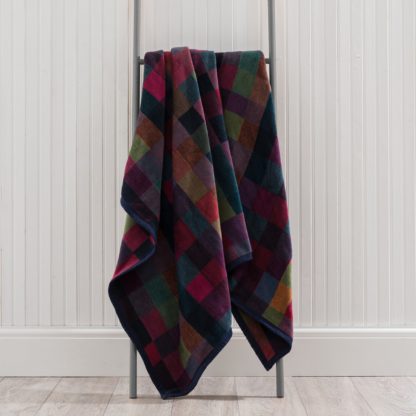 8f4d1c3de46acad5e9b0da96d08af179dff85d107f1c3ca4b2ae3e95195ee288.jpg An Image of Super Soft Multicoloured Check Throw Navy Blue and Red