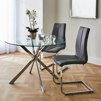 An Image of Lumia Glass Round Dining Set with Jamison Chairs Clear