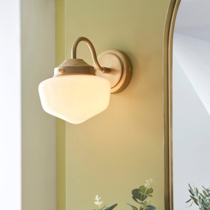 81ea7292279f8632a5960bb7b4d0fce5678b2ef829d389045a53926c5a9edc1e.jpg An Image of Mondez Bathroom Wall Light Satin Gold