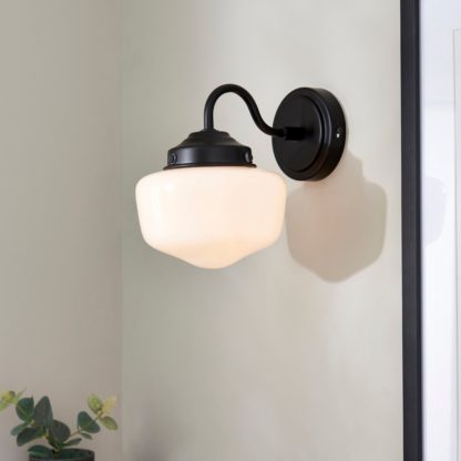 a6764a2c5601795fccb099892874712df375673e90473a3e2b154682e0901f48.jpg An Image of Mondez Bathroom Wall Light Satin Gold