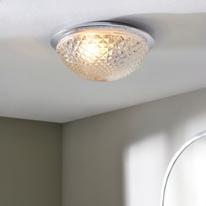 eb6f99411aa160c29db1c1db2fa563ff8320ddcec5ab2b139d87b958767ef472.jpg An Image of Tropic Faceted Dome Flush Bathroom Ceiling Fitting Clear