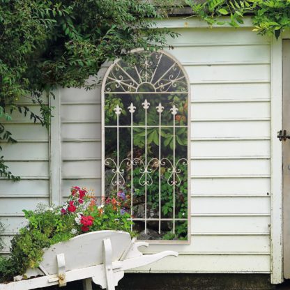 An Image of MirrorOutlet Somerley Gate Gothic Arch Stone Coloured Large metal Garden Mirror - 140 x 65 cm