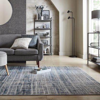 328134cd6923c68cbae7c080e625d487db599ab62c3fa370f3122038cca0076c.jpg An Image of Rae Abstract Rug Blue