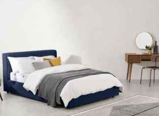 An Image of Bahra Midnight Blue Fabric Ottoman Storage Bed Frame - 5ft King Size