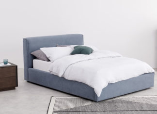 An Image of Bahra Washed Blue Fabric Ottoman Storage Bed Frame - 5ft King Size