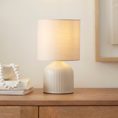 ef397f4b20dfae770f7367aa41d81b5c60df746682f7f66a9283650026a91e19.jpg An Image of Hebe Ribbed Ceramic Table Lamp Cream