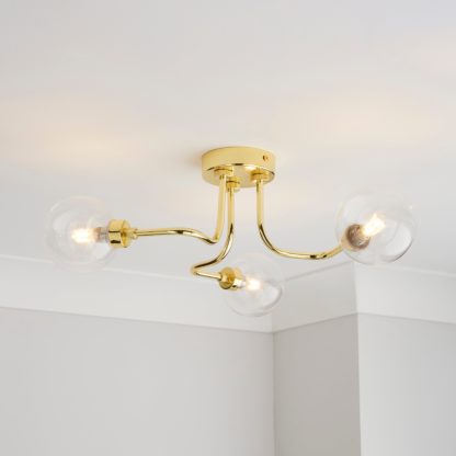 An Image of Tanner 3 Light Semi Flush Ceiling Fitting Gold