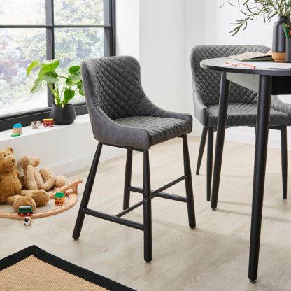 b6823df3727b478a164ec17e539cd54498a19f3783437ceaad3e382473a26c61.jpg An Image of Montreal Junior Faux Leather Dining Chair Brown