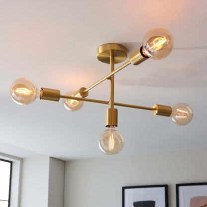 8fba8fbcebec0b4ad4011cfd918f4a83ef436abb8b588c12b5312b153117fee2.jpg An Image of Logie Semi Flush Ceiling Light - Brass Effect