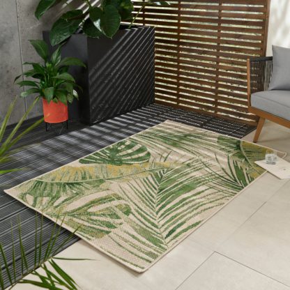 An Image of Aurora Jungle Plain Indoor Outdoor Rug Green