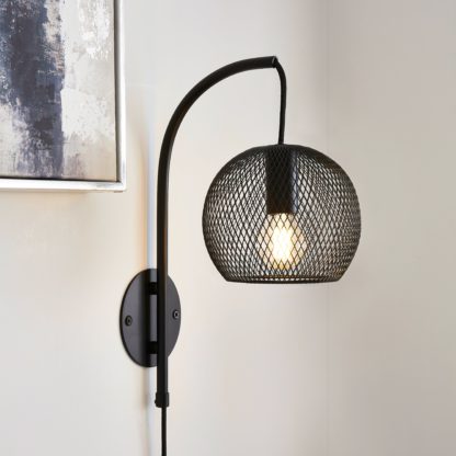 1b8c1ebb11fad78a832ecbb2579322f5f5a48f8fbb5b315c83a014ada734c7ce.jpg An Image of Harrison Easy Fit Plug In Wall Light Black