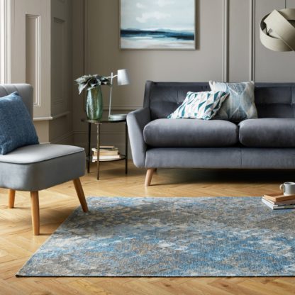 d0992df5f00eafa1421eb855d03512a4a193fd99c4ab30ca0950a9e468a7a0d7.jpg An Image of Mamba Snake Print Rug Blue/Brown/Yellow
