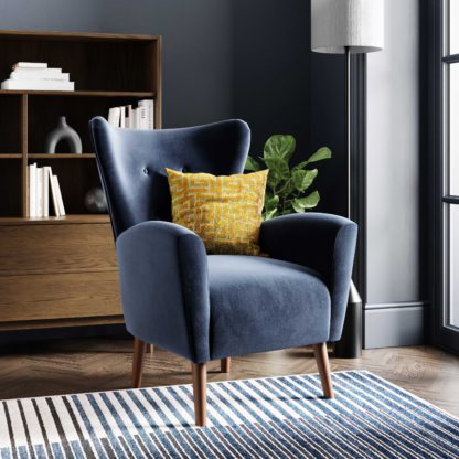 021927481b605a47ac26004691949a44fa82eed7f0b6f4b68fb413351033913f.jpg An Image of Sven Velvet Modern Wing Chair Velvet Old Gold