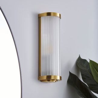An Image of Ripon Bathroom Wall Light Brushed Gold Gold